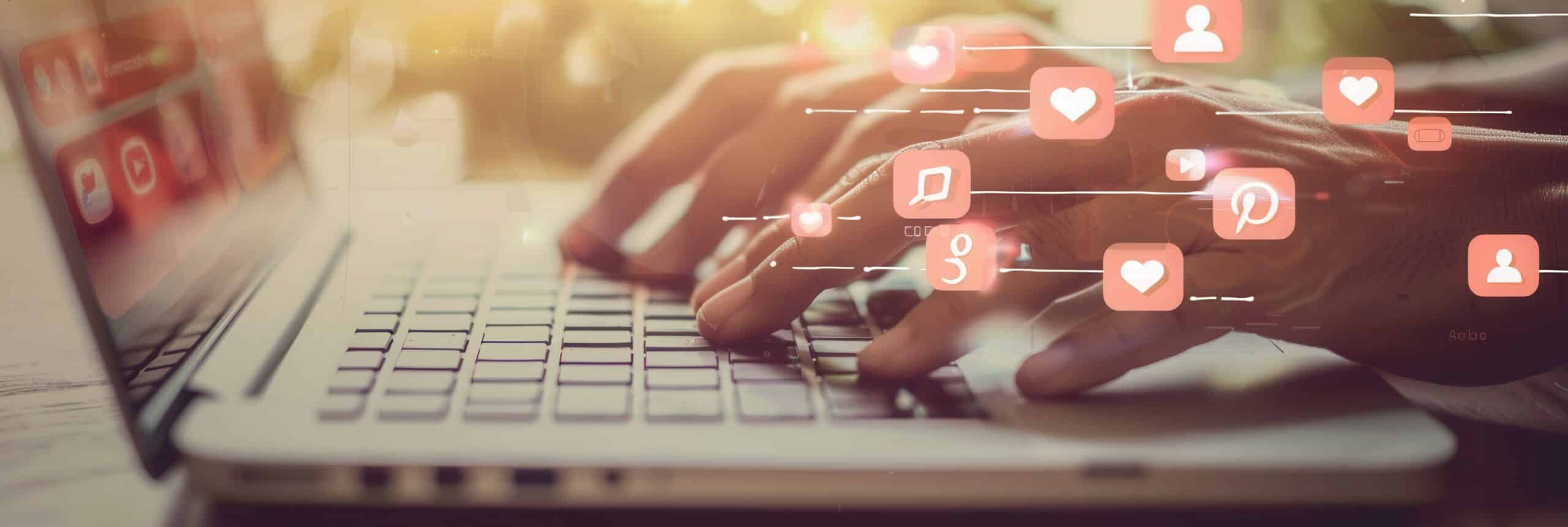 Hands typing on a laptop with social media icons floating around, representing the online world of digital engagement. Generative AI